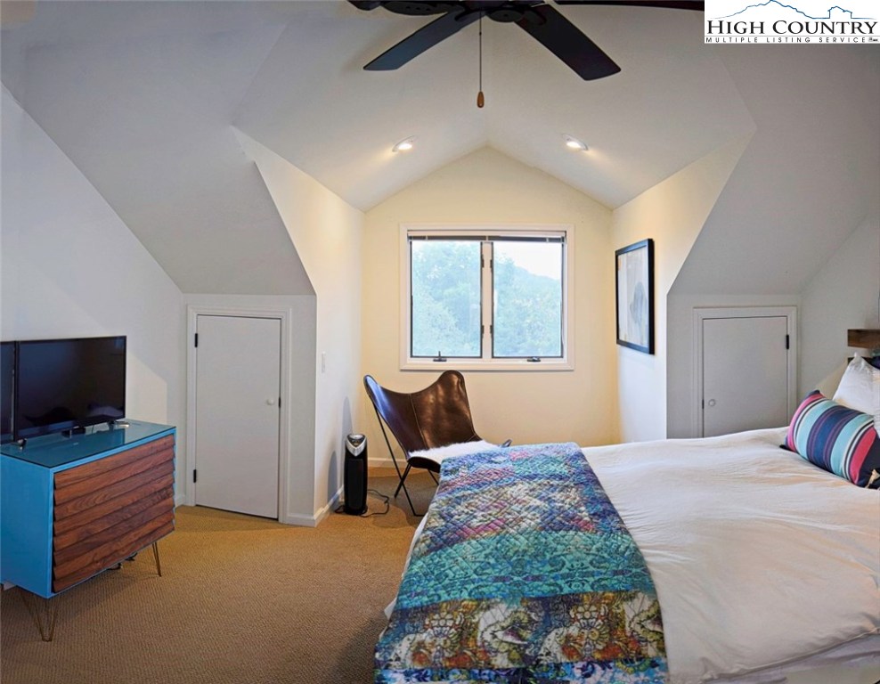 250 Ascot Lane Boone, NC 28607 - Photo 27 of 44 a bedroom with a bed and flat screen tv