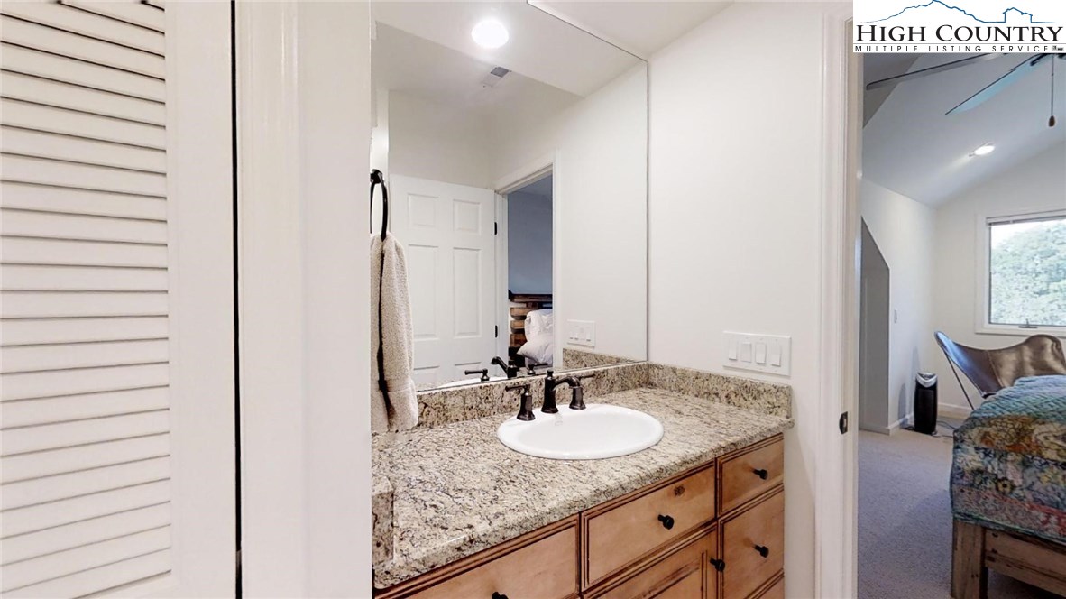 250 Ascot Lane Boone, NC 28607 - Photo 38 of 44 a bathroom with a granite countertop sink and a mirror