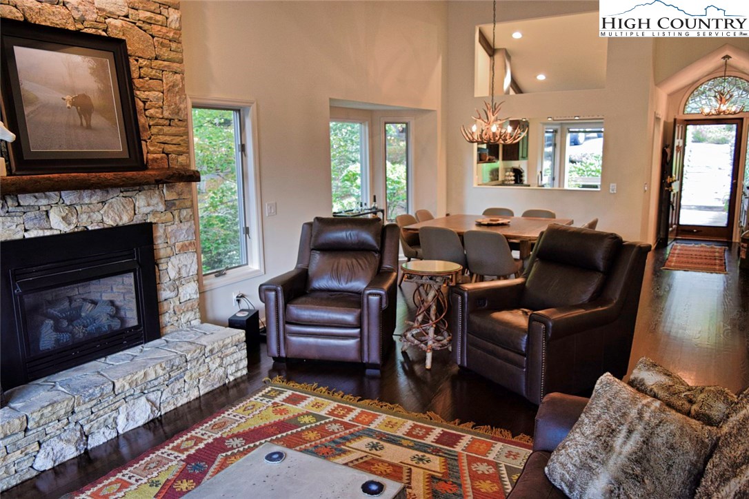 250 Ascot Lane Boone, NC 28607 - Photo 10 of 44 a living room with furniture and a fireplace