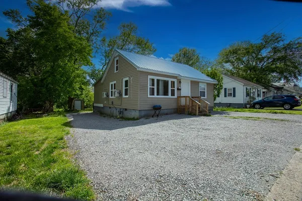 a house with trees in the background