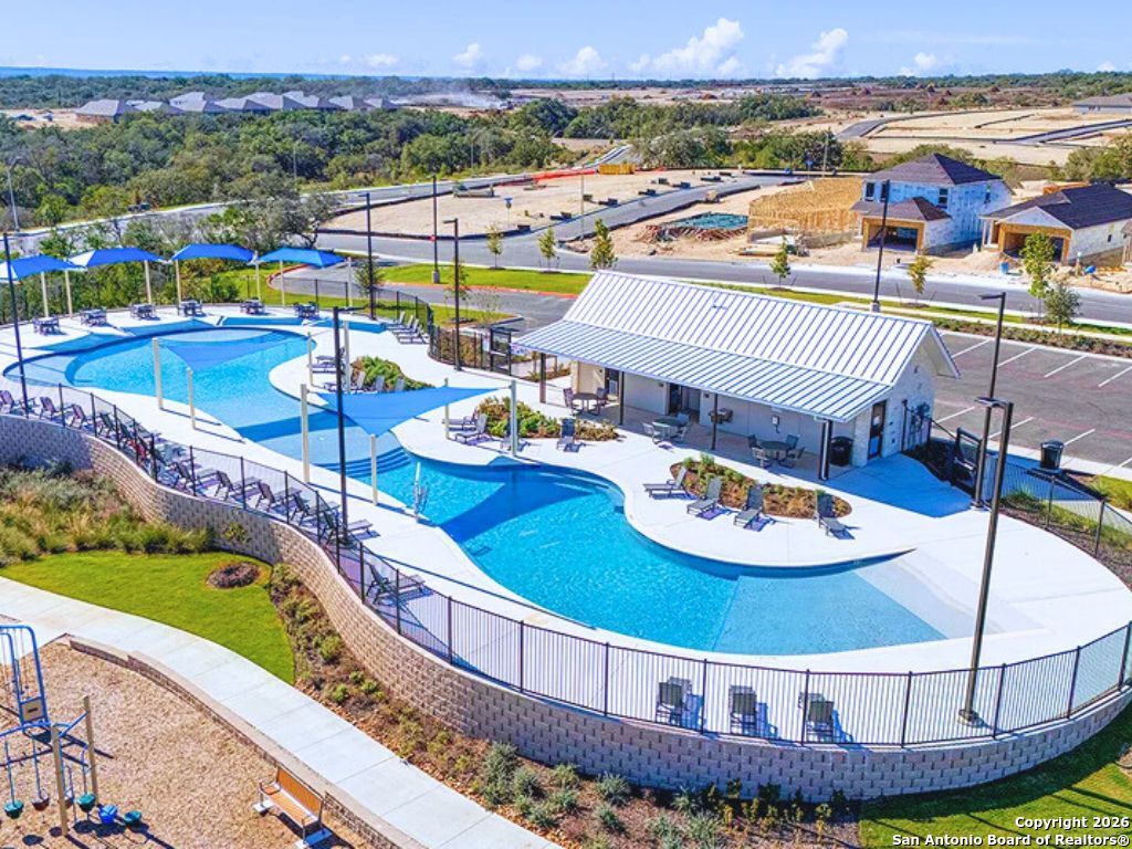 3703 Millbrook Way San Antonio, TX 78245 - Photo 8 of 10 a view of a balcony with a table and chairs
