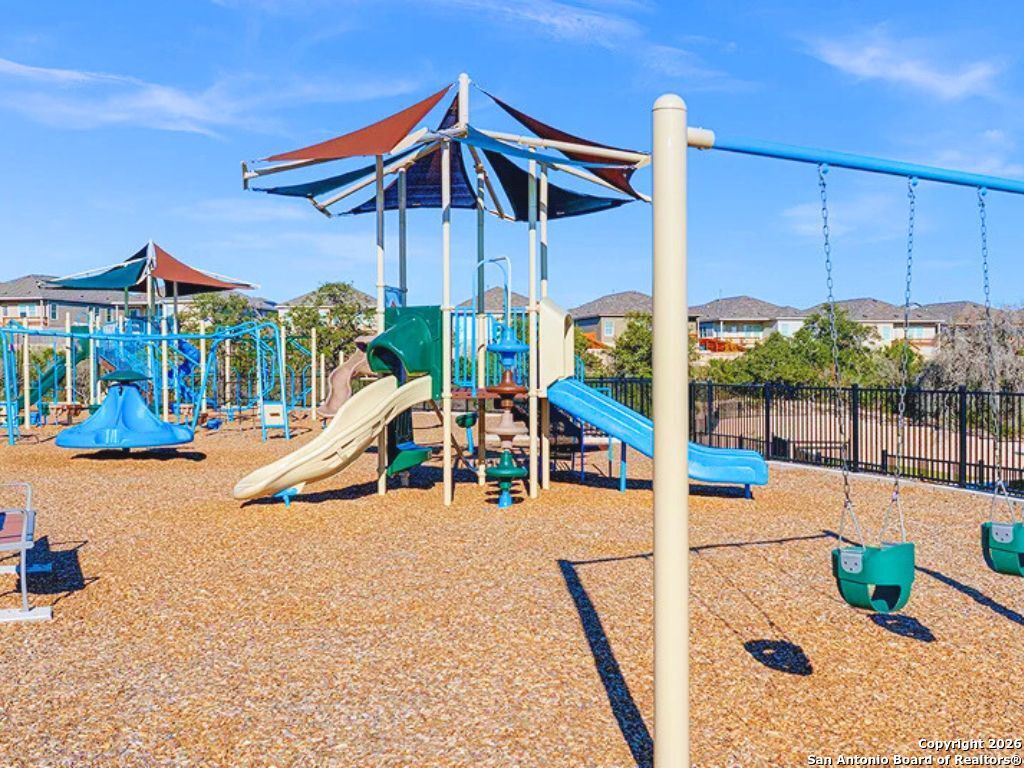 3703 Millbrook Way San Antonio, TX 78245 - Photo 9 of 10 a view of a swimming pool with a lounge chair