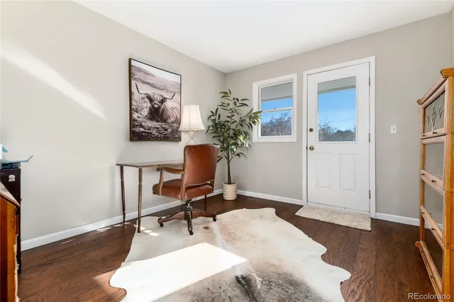 a workspace with furniture and a window