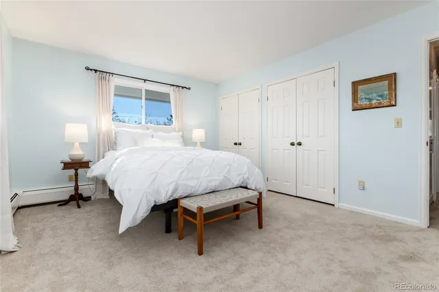 a bedroom with a bed and a table