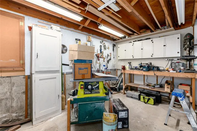 a kitchen with stainless steel appliances granite countertop a refrigerator and a stove