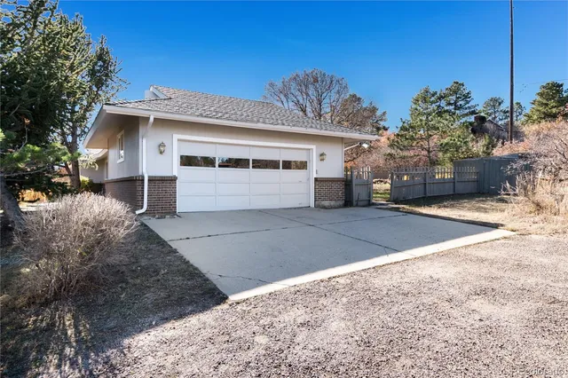 a view of a house with a yard and garage