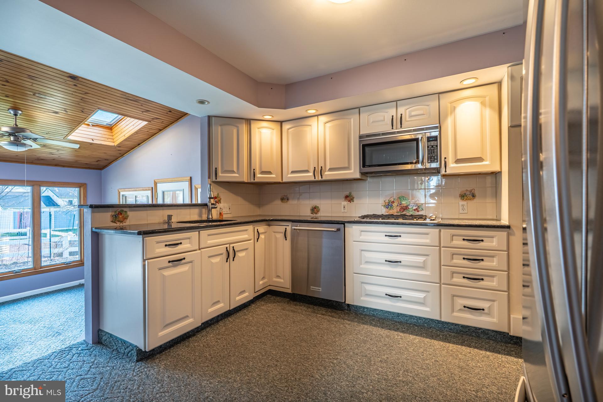 159 Forrest Avenue Southampton, PA 18966 - Photo 9 of 48 a kitchen with granite countertop a sink cabinets and stainless steel appliances