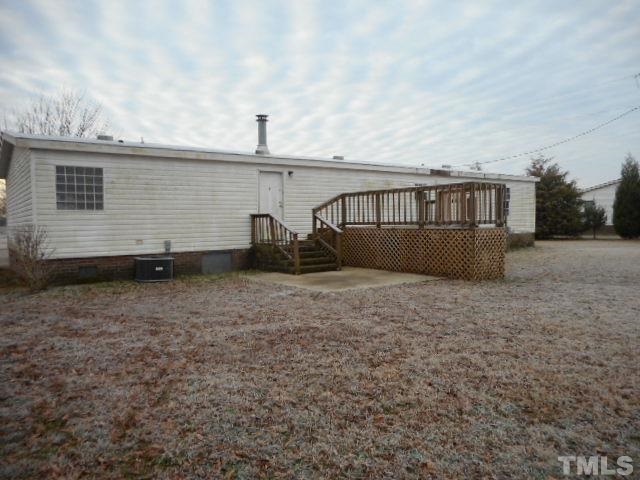 8124 Wiggins Mill Road Lucama, NC 27851 - Photo 2 of 12 a view of a house with backyard