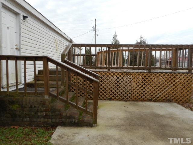 8124 Wiggins Mill Road Lucama, NC 27851 - Photo 12 of 12 a view of wooden balcony