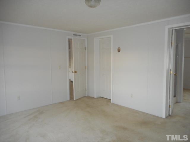 8124 Wiggins Mill Road Lucama, NC 27851 - Photo 6 of 12 a view of an empty room