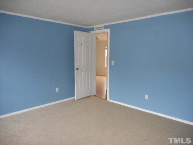 8124 Wiggins Mill Road Lucama, NC 27851 - Photo 8 of 12 a view of an empty room