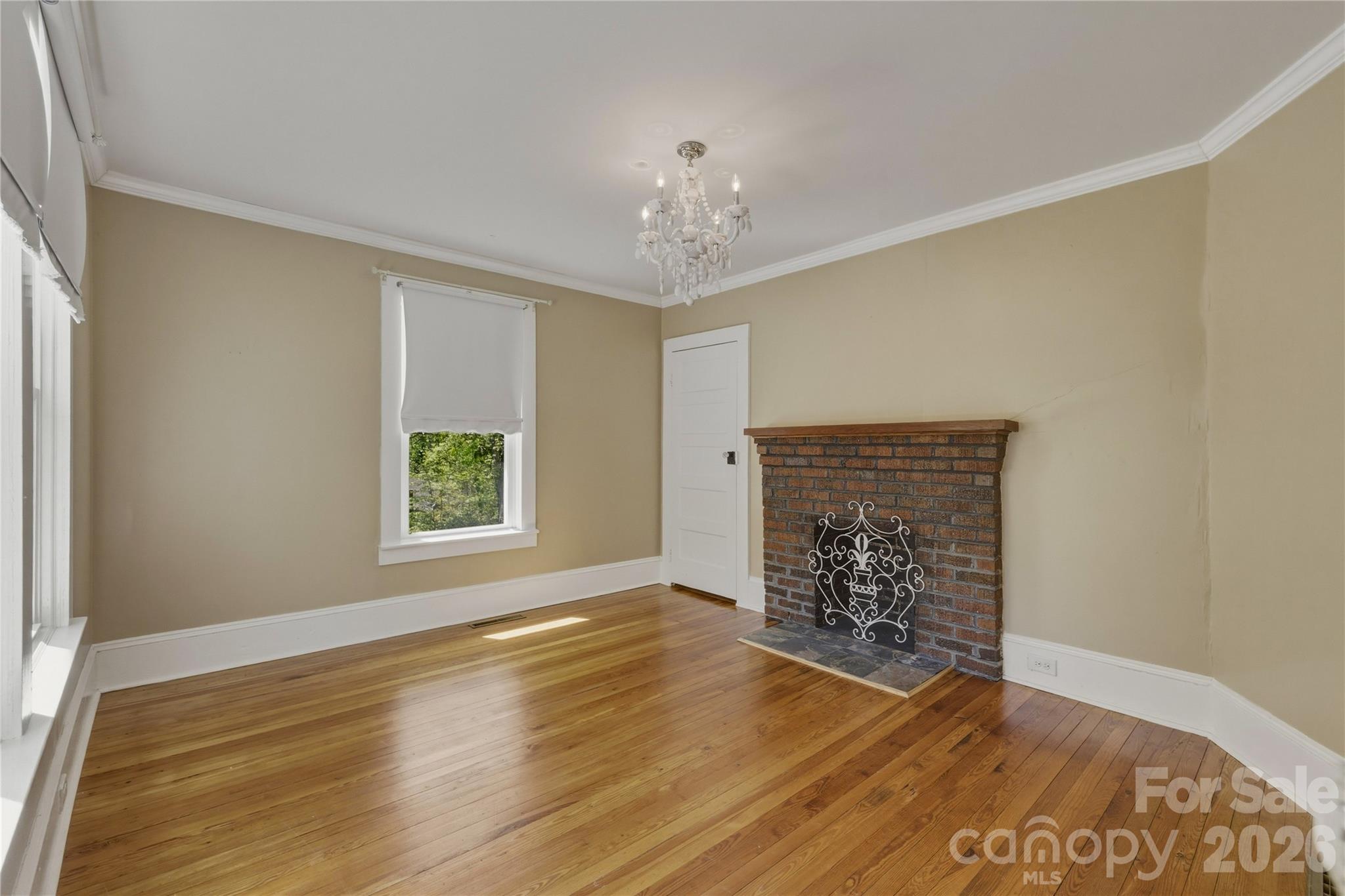 512 Alexander Avenue Morganton, NC 28655 - Photo 14 of 29 wooden floor in an empty room with a window