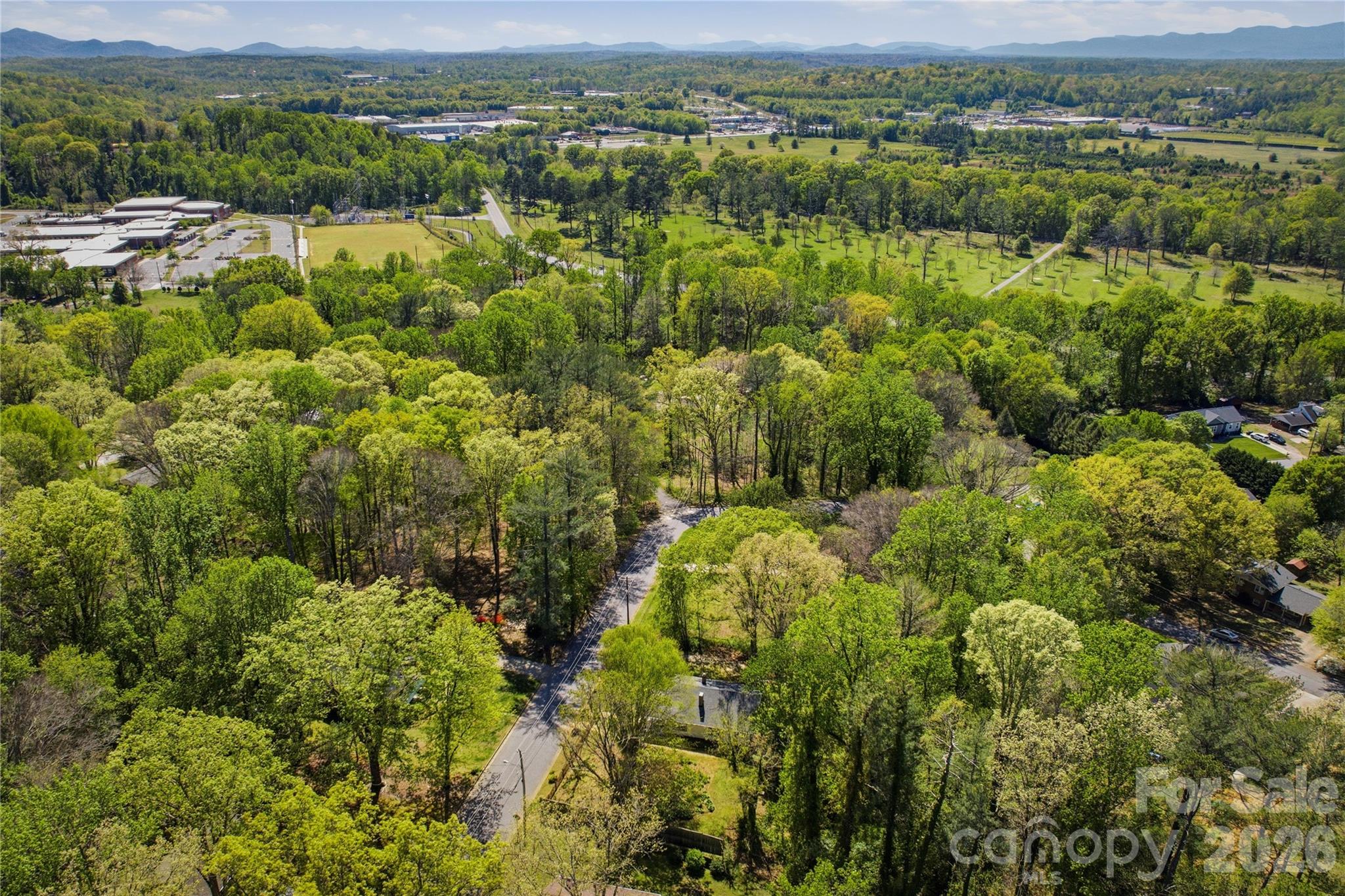 512 Alexander Avenue Morganton, NC 28655 - Photo 26 of 29 an aerial view of residential houses with outdoor space and mountain view