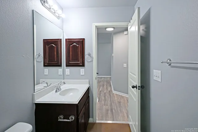 a bathroom with a sink and a mirror