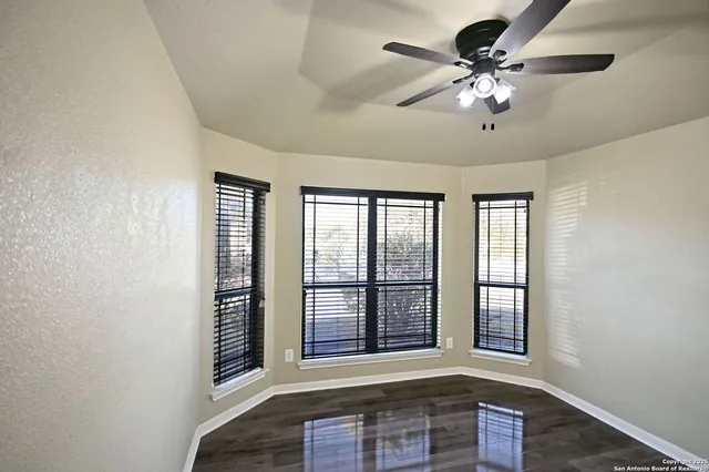 a view of an empty room with a window