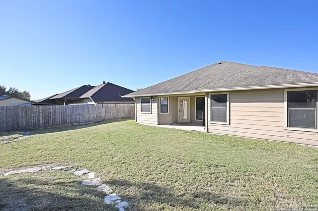 a house with yard in front of it