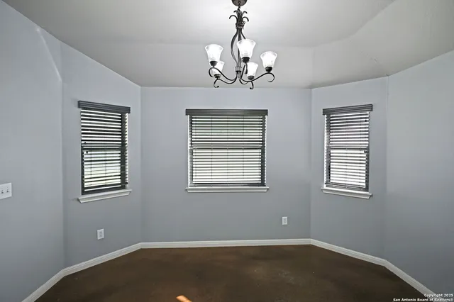 a view of a room with windows