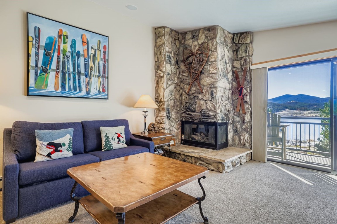 160 La Bonte Street, Unit 306 Dillon, CO 80435 - Photo 15 of 47 a living room with furniture a fireplace and a flat screen tv