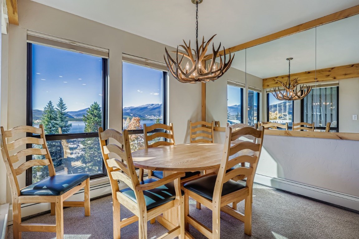 160 La Bonte Street, Unit 306 Dillon, CO 80435 - Photo 5 of 47 a view of a dining room with furniture wooden floor and chandelier