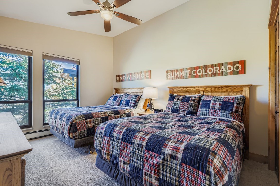 160 La Bonte Street, Unit 306 Dillon, CO 80435 - Photo 8 of 47 a bed sitting in a bedroom next to a window