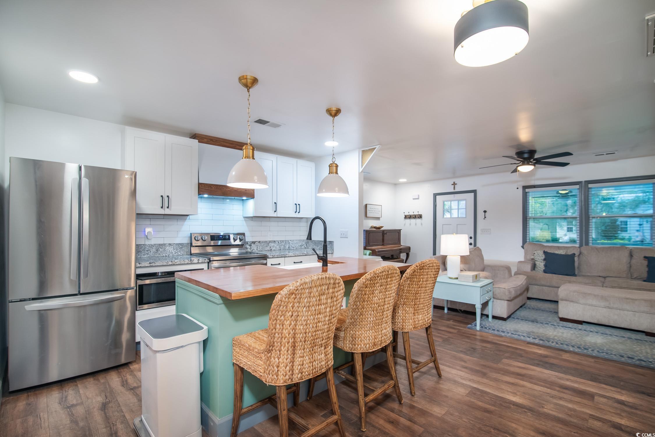1714 Oak Street Georgetown, SC 29440 - Photo 12 of 40 Kitchen with an island with sink, hanging light fi