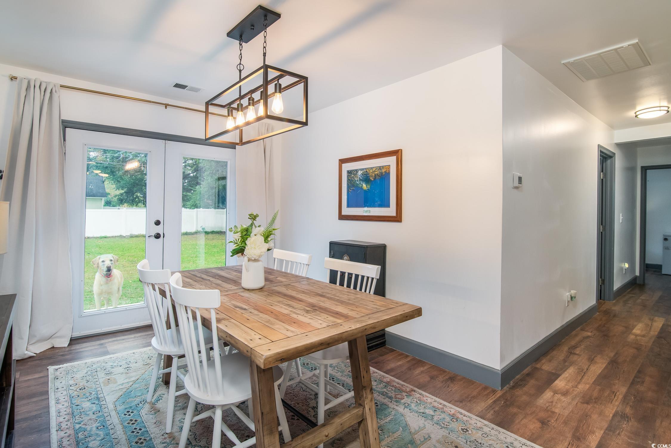 1714 Oak Street Georgetown, SC 29440 - Photo 15 of 40 Dining area featuring french doors and dark hardwo