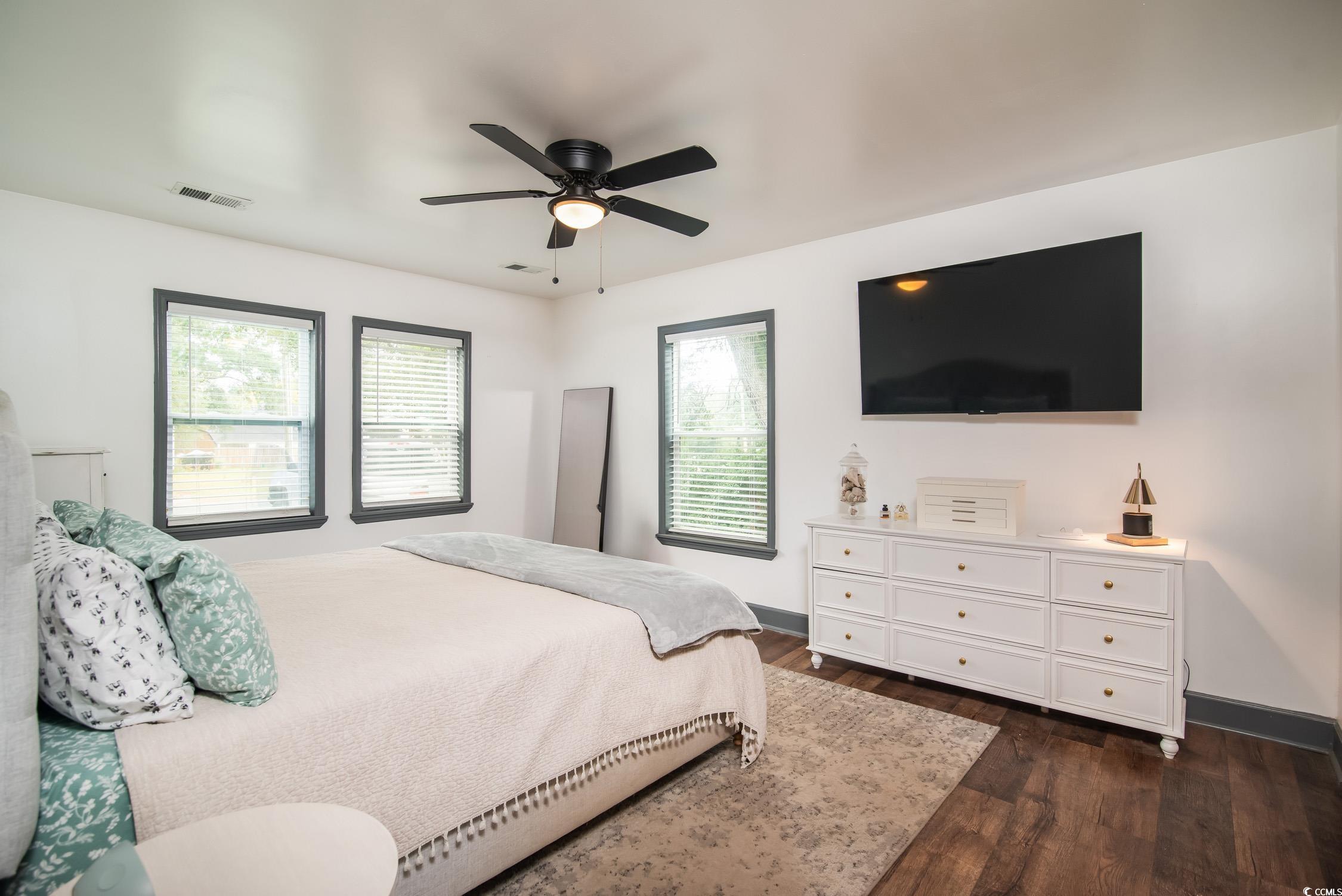 1714 Oak Street Georgetown, SC 29440 - Photo 24 of 40 Bedroom with dark wood-type flooring, multiple win