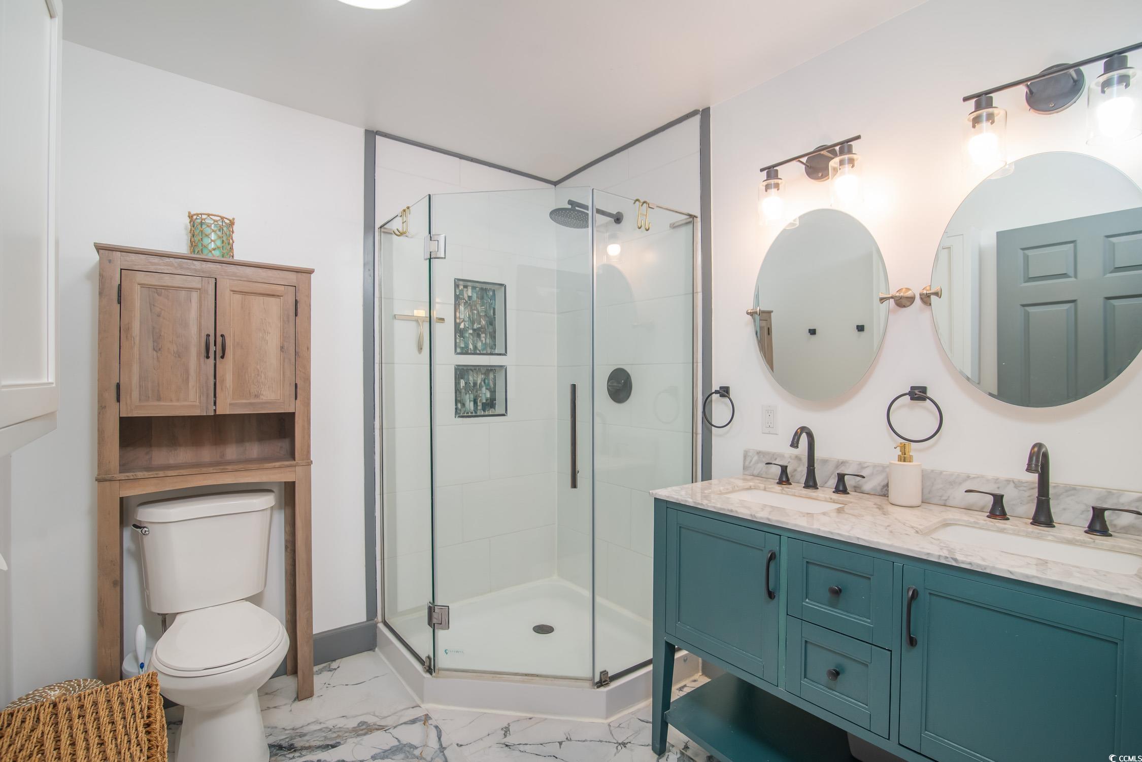 1714 Oak Street Georgetown, SC 29440 - Photo 27 of 40 Bathroom featuring vanity, toilet, and walk in sho