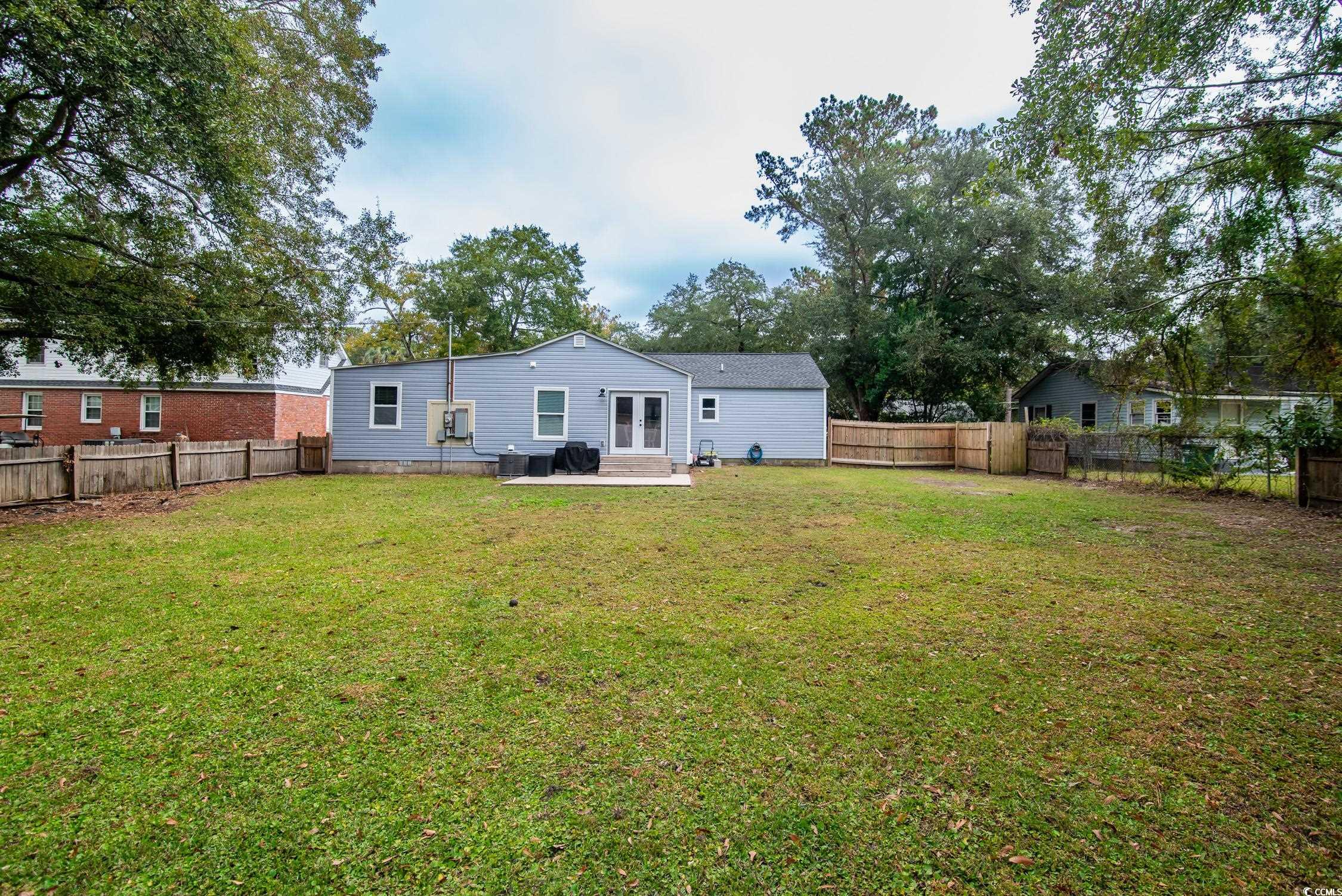 1714 Oak Street Georgetown, SC 29440 - Photo 31 of 40 Back of property featuring a yard and central AC u