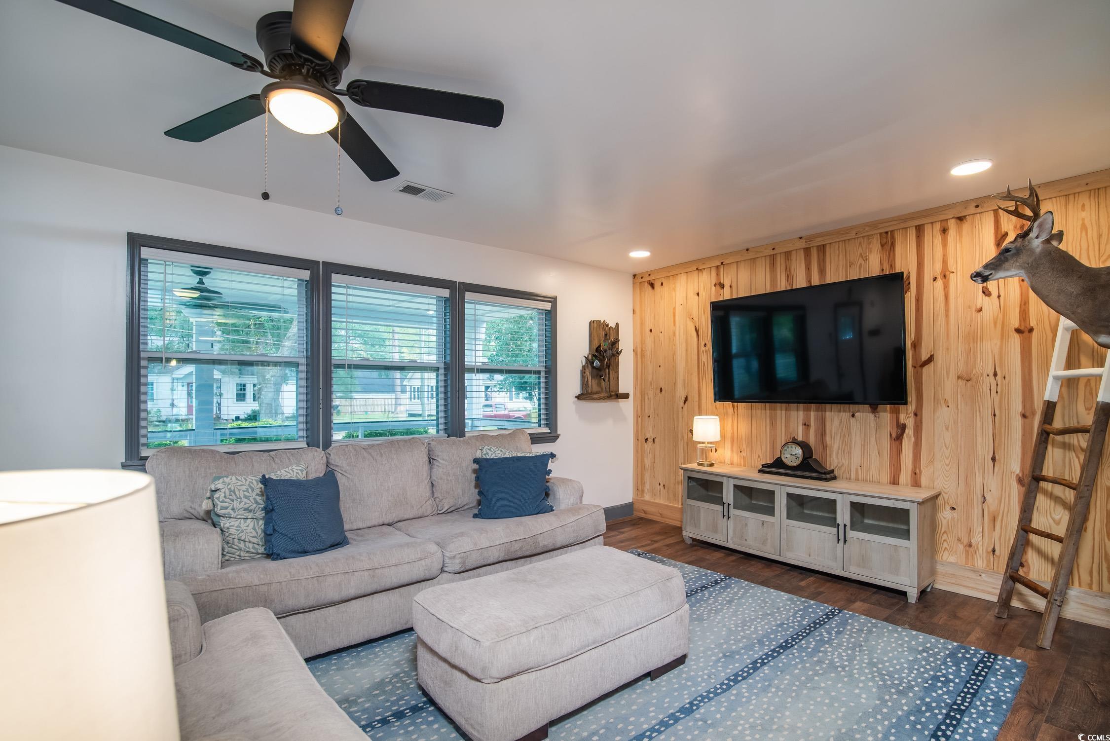 1714 Oak Street Georgetown, SC 29440 - Photo 8 of 40 Living room featuring wooden walls, dark hardwood