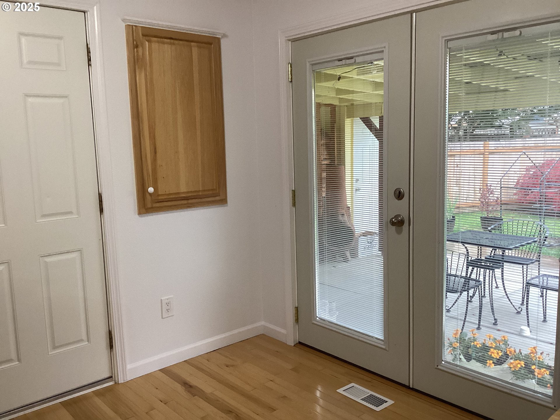 17706 Southeast Washington Street Portland, OR 97233 - Photo 12 of 34 an empty room with windows and wooden floor