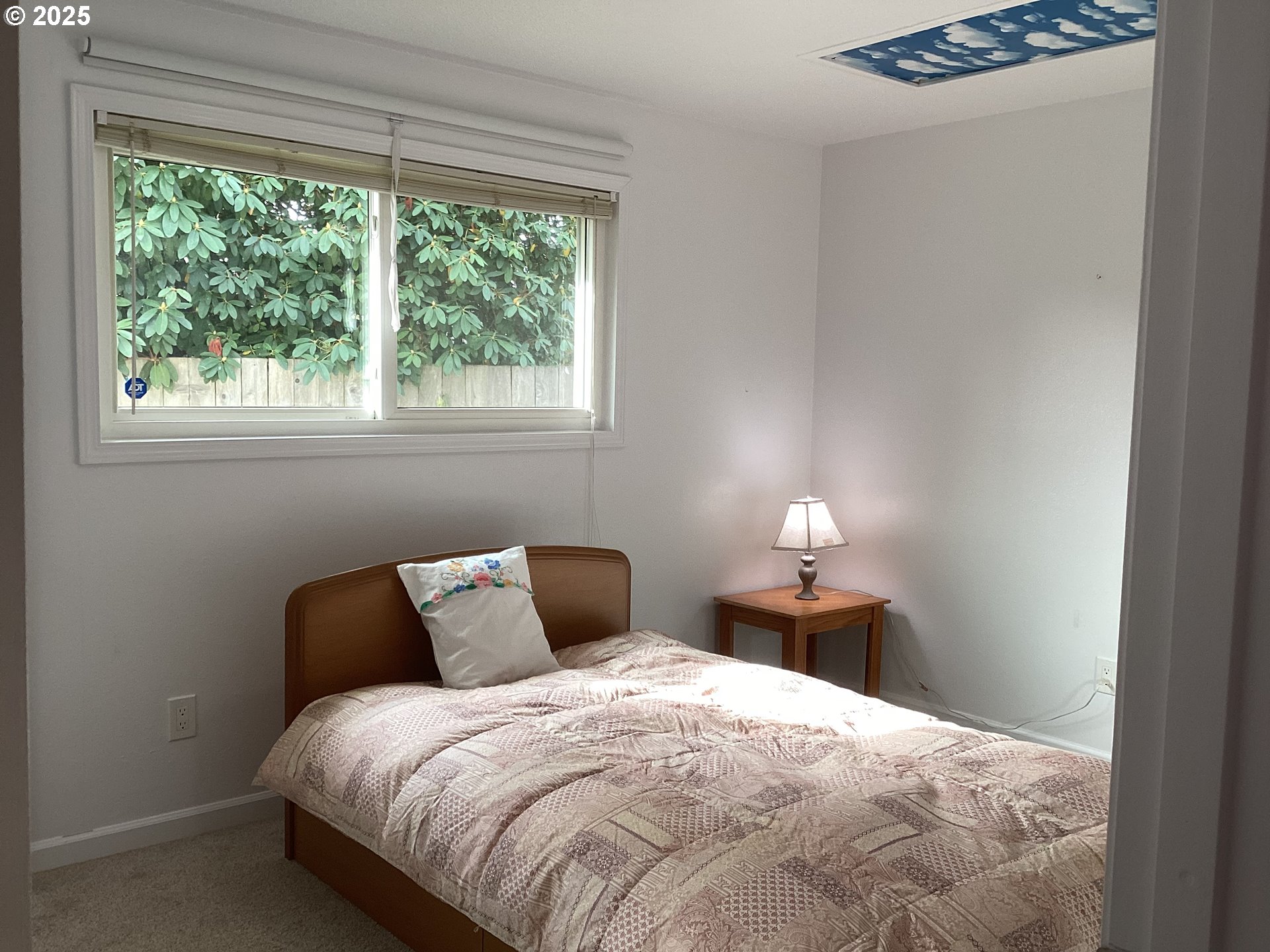 17706 Southeast Washington Street Portland, OR 97233 - Photo 14 of 34 a bedroom with a bed and window