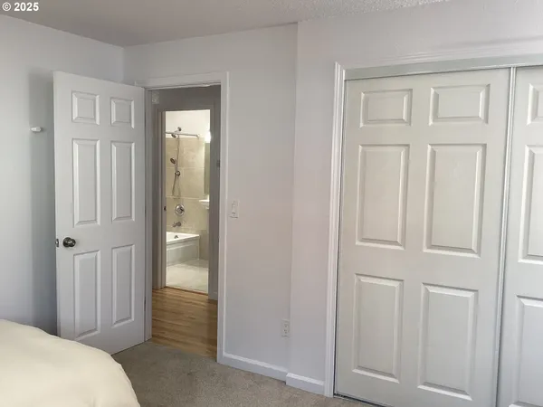 a view of a bedroom from the hallway