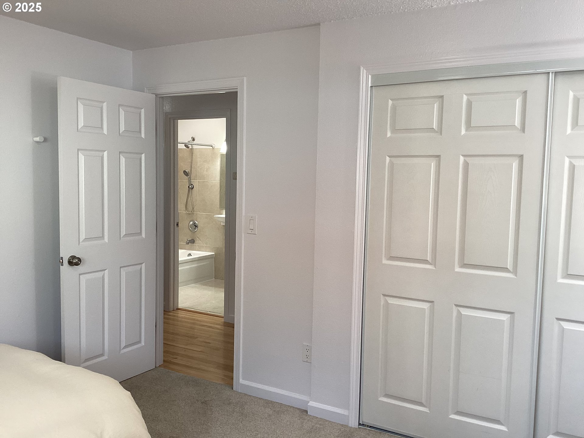 17706 Southeast Washington Street Portland, OR 97233 - Photo 19 of 34 a view of a bedroom from the hallway