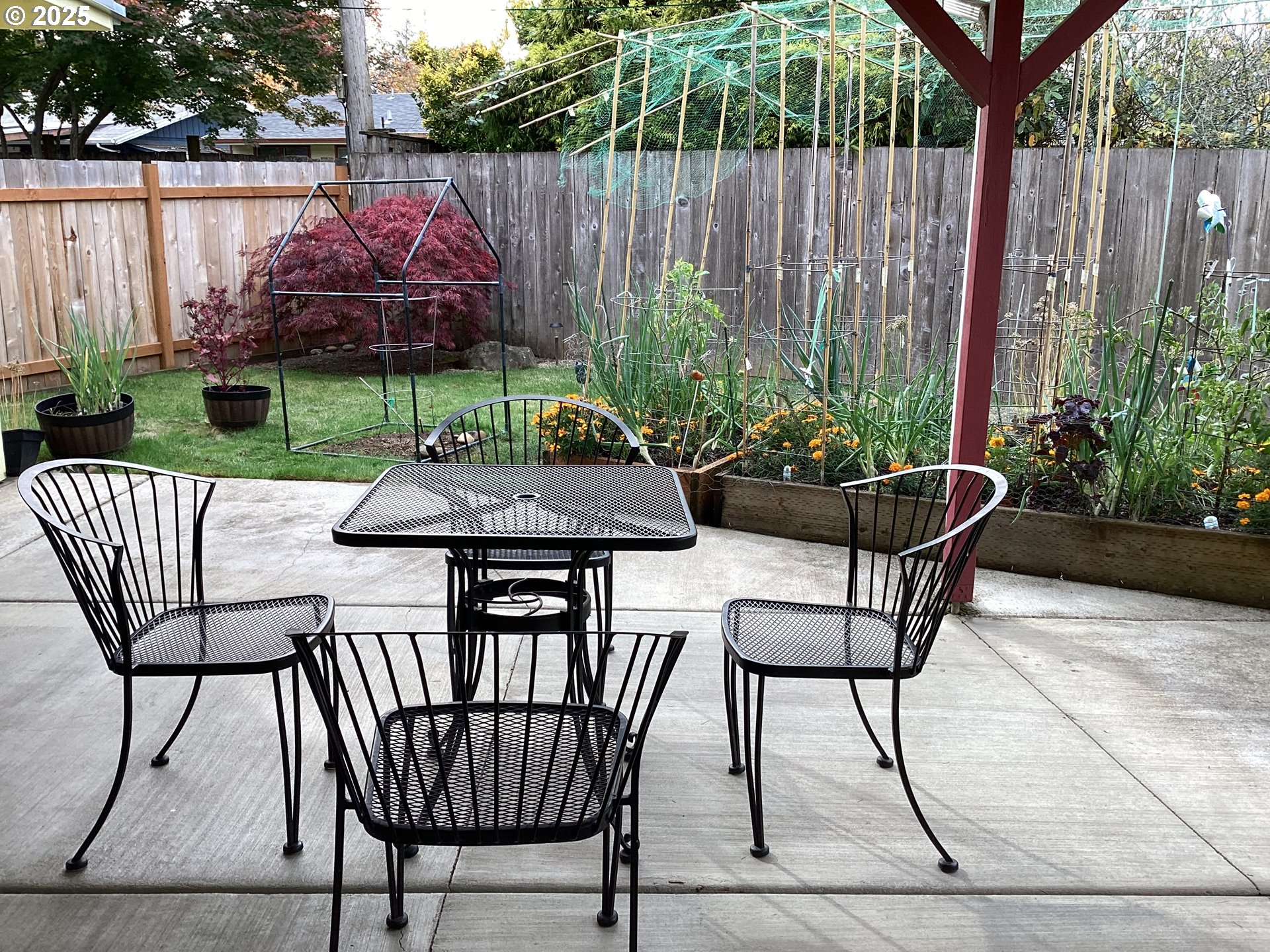 17706 Southeast Washington Street Portland, OR 97233 - Photo 23 of 34 a view of a chairs and table in back yard of a house