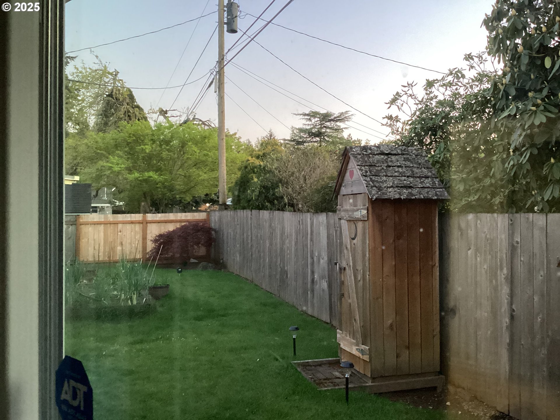 17706 Southeast Washington Street Portland, OR 97233 - Photo 24 of 34 a view of a backyard with wooden fence