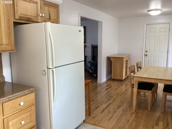 a white refrigerator freezer sitting in a kitchen