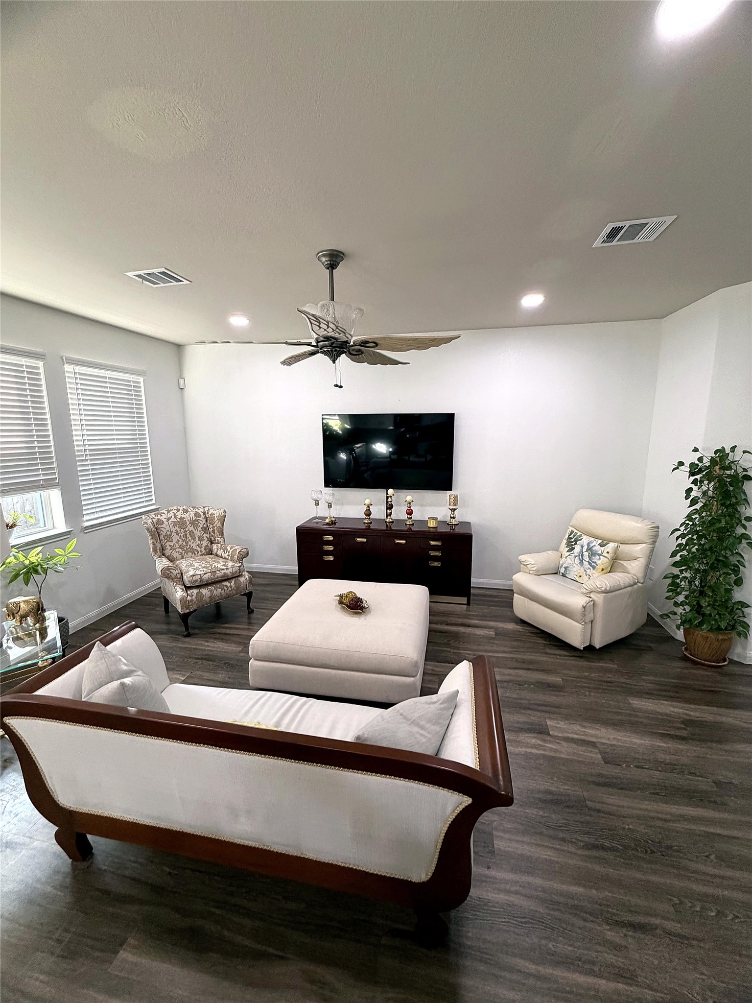 18623 Dingo Stream Lane Katy, TX 77449 - Photo 4 of 29 a living room with furniture and a flat screen tv