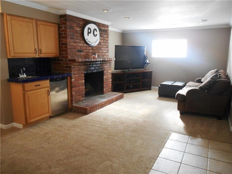 505 Harrogate Road Pittsburgh, PA 15241 - Photo 18 of 23 Lower level family room with log burning fireplace and wet bar.