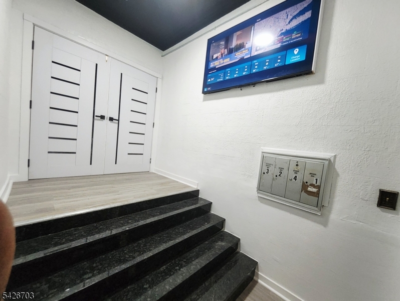 49 Union Place, Unit 3 Irvington, NJ 07111 - Photo 4 of 20 a view of staircase with white walls