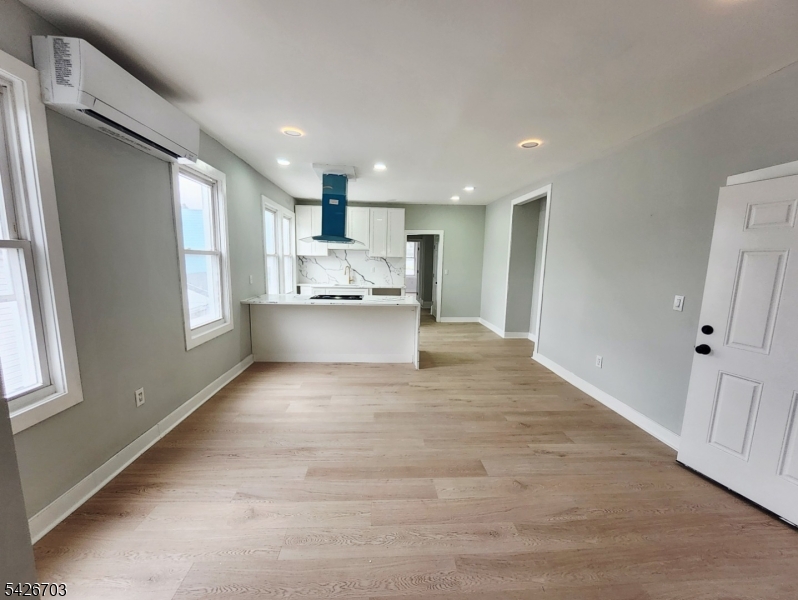 49 Union Place, Unit 3 Irvington, NJ 07111 - Photo 6 of 20 a view of kitchen with wooden floor and electronic appliances