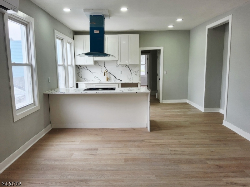 49 Union Place, Unit 3 Irvington, NJ 07111 - Photo 7 of 20 a view of kitchen with stainless steel appliances cabinets and wooden floor