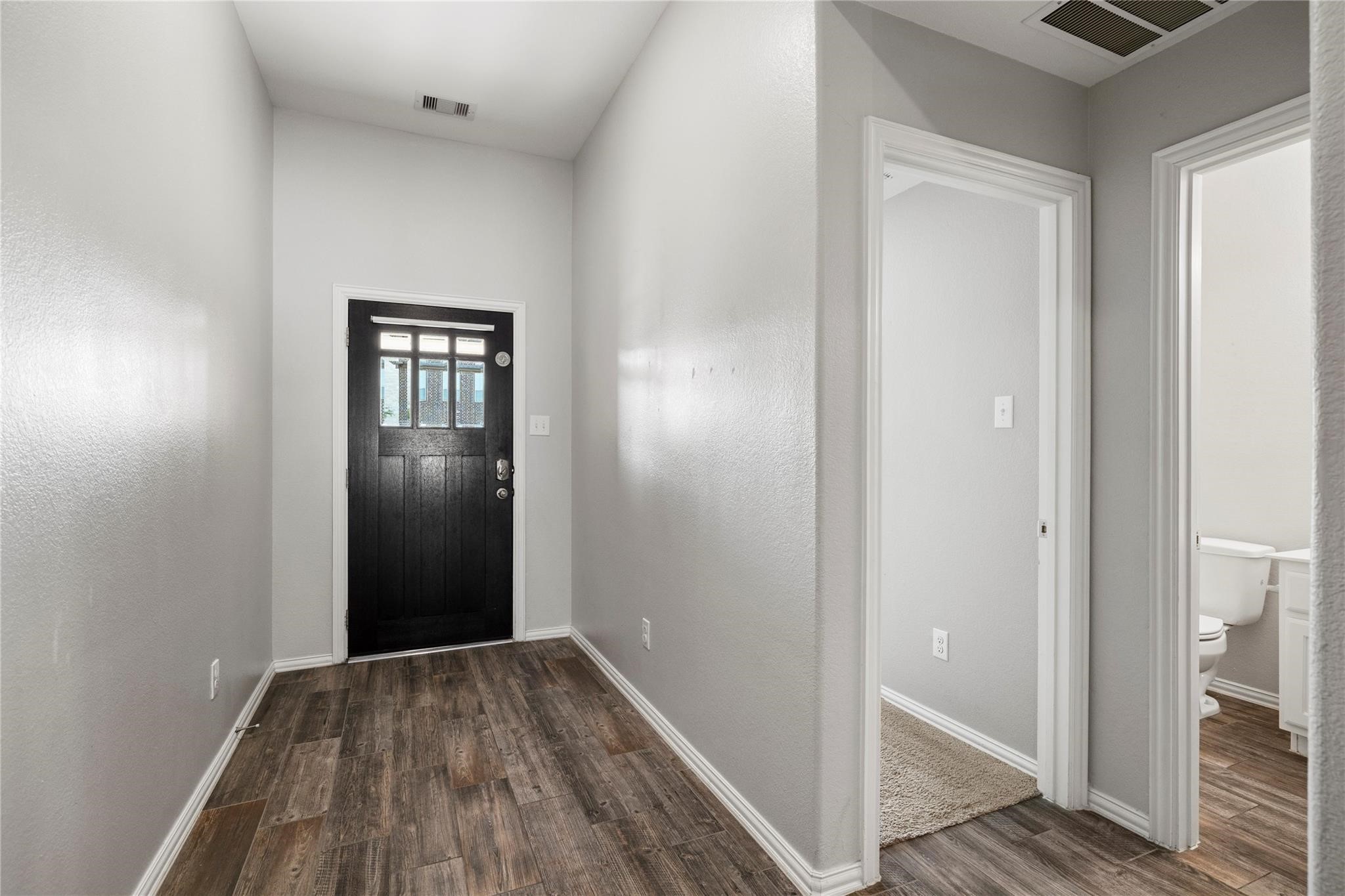 29507 Whitebrush Trace Drive Spring, TX 77386 - Photo 27 of 32 Front entry hallway with wood-look flooring and access to main living areas.