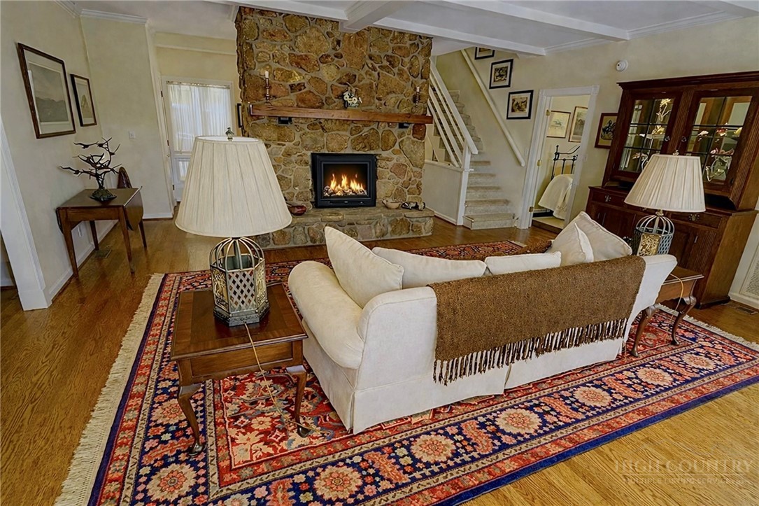638 Ridge Road Glade Valley, NC 28627 - Photo 7 of 44 a living room with furniture and a fireplace
