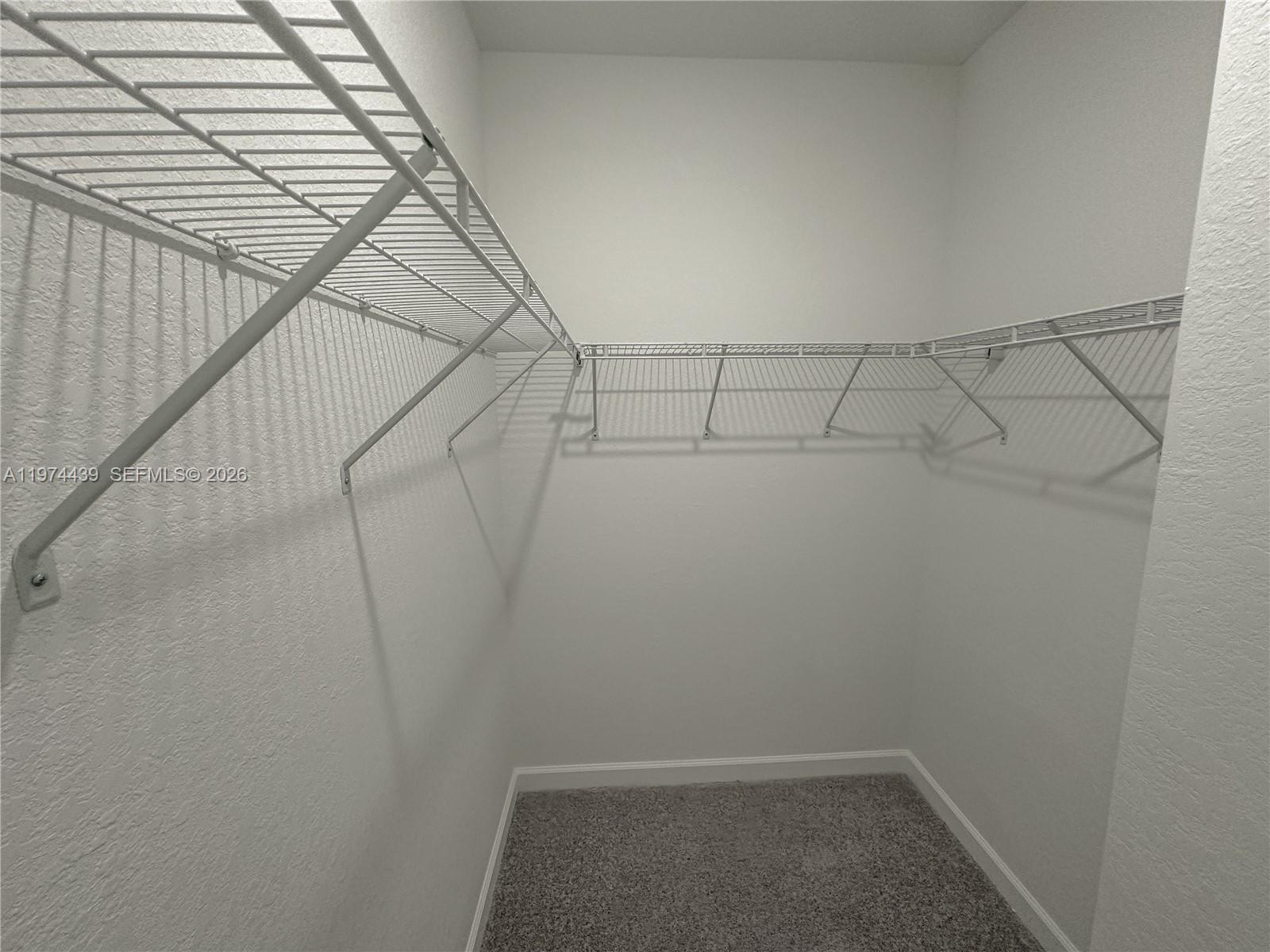 14804 Southwest 162nd Street Miami, FL 33177 - Photo 11 of 22 a view of a room with racks on the wall