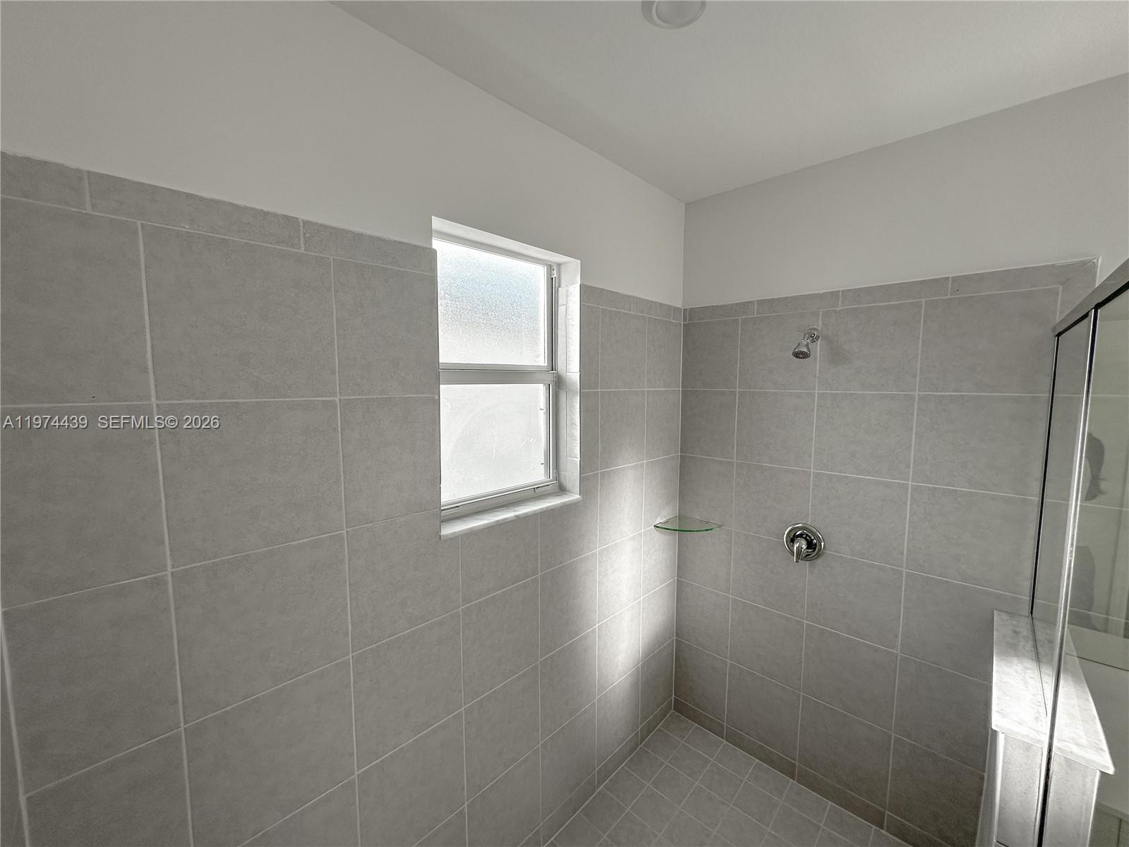 14804 Southwest 162nd Street Miami, FL 33177 - Photo 13 of 22 a bathroom with a shower