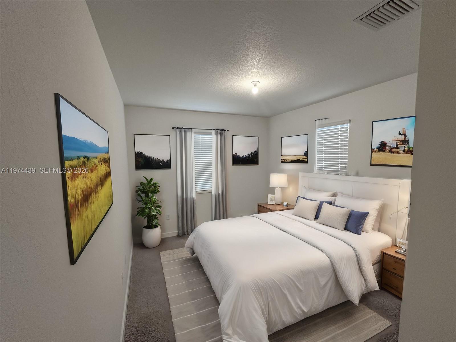 14804 Southwest 162nd Street Miami, FL 33177 - Photo 14 of 22 a bedroom with a bed and a flat screen tv