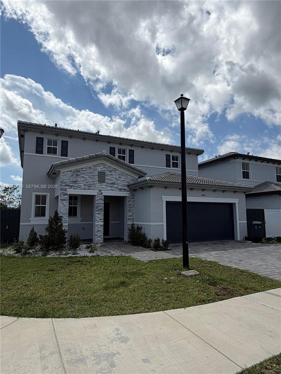 14804 Southwest 162nd Street Miami, FL 33177 - Photo 2 of 22 a view of a yard in front of a house