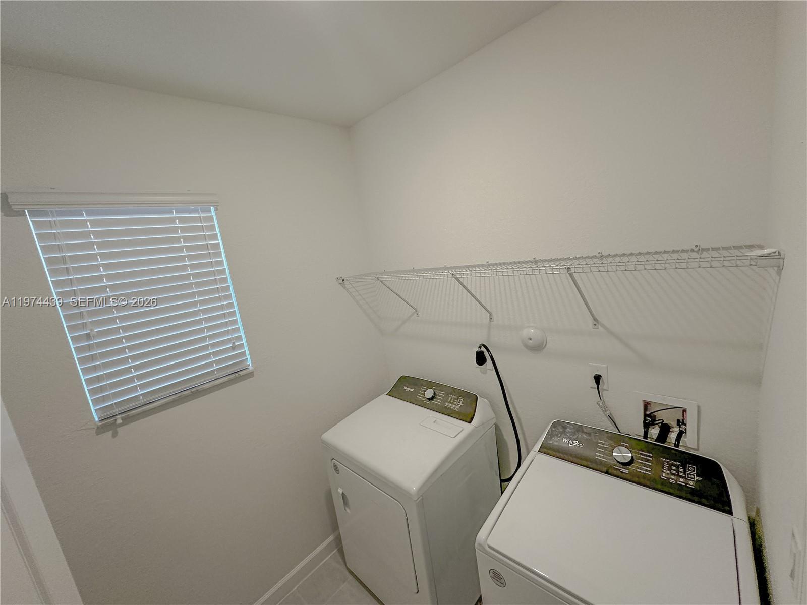14804 Southwest 162nd Street Miami, FL 33177 - Photo 21 of 22 a utility room with dryer and washer