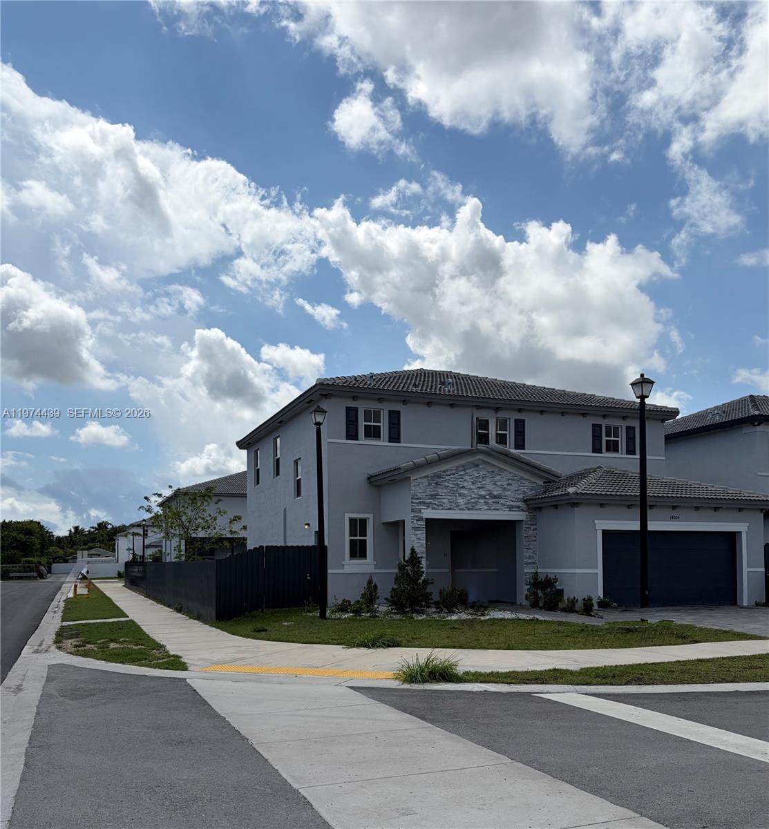 14804 Southwest 162nd Street Miami, FL 33177 - Photo 3 of 22 a front view of a house with a garden
